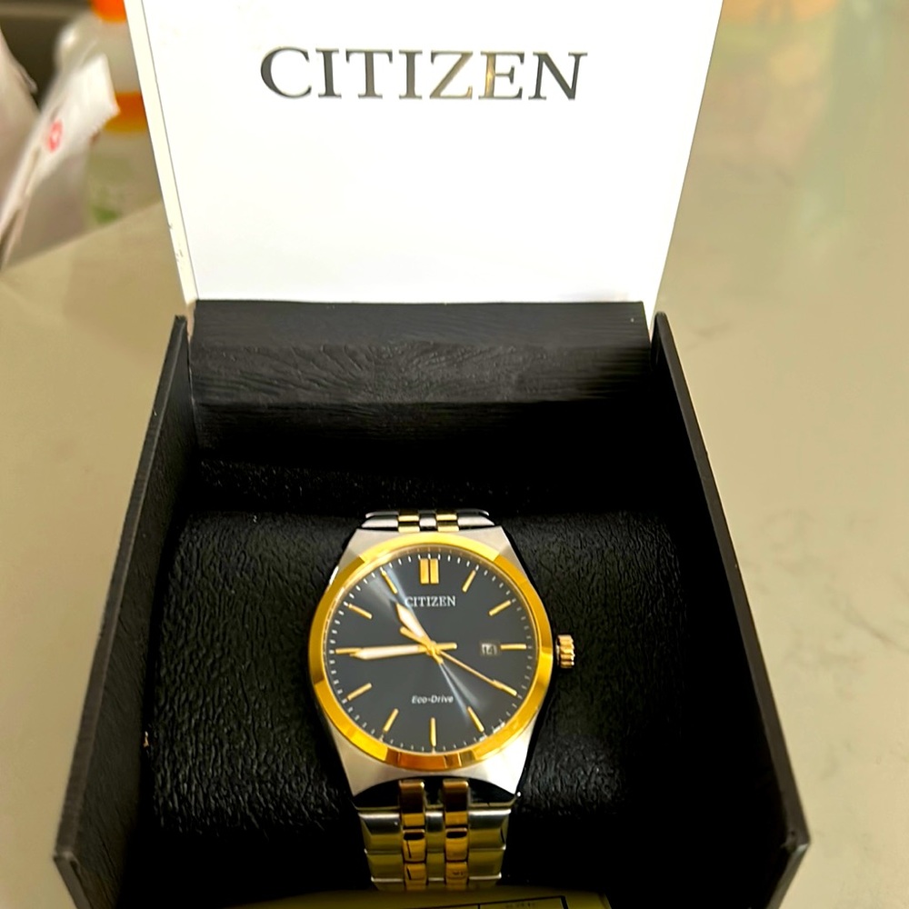 Like new Citizen Eco-Drive Corso, two tone, with hand-date-blue.